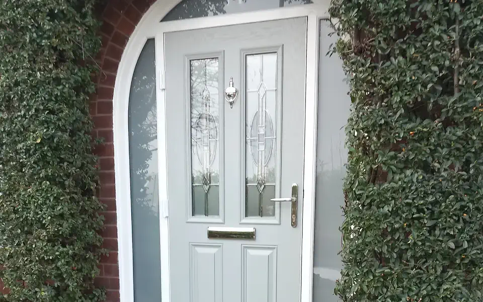 a green front composite door with silver knocker and handle